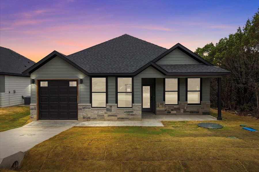 Front exterior of a new home in , Granbury, TX, highlighting curb appeal (Image 18).
