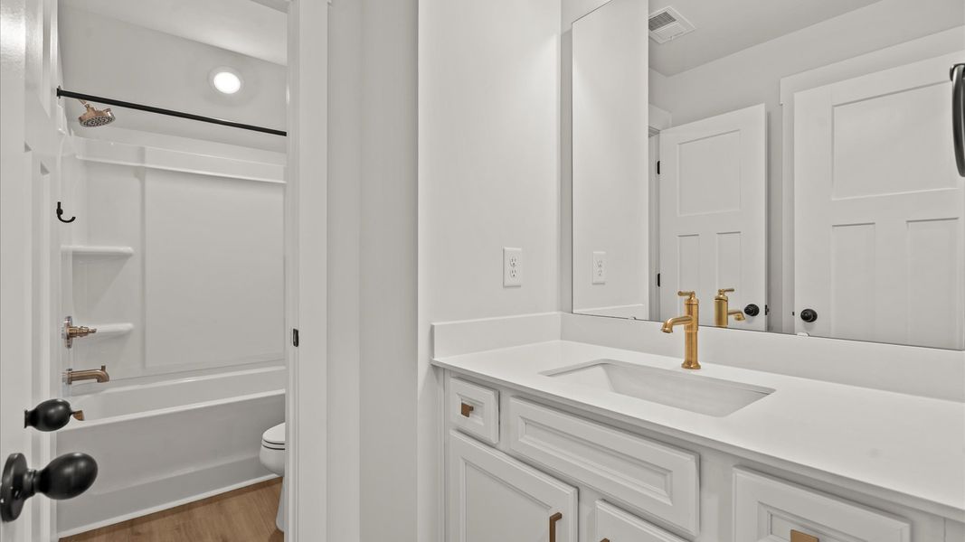 Stylish guest bathroom with superior design and thoughtful storage solutions Stylish guest bathroom with superior design and thoughtful storage solutions