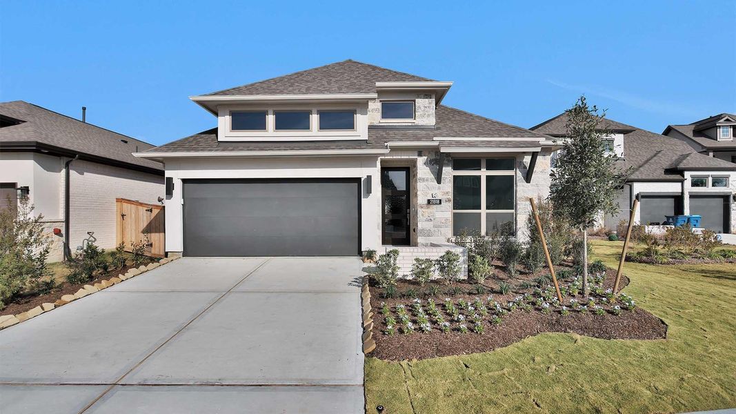Front exterior of a new home in Bridgeland, Cypress, TX, highlighting curb appeal (Image 2).