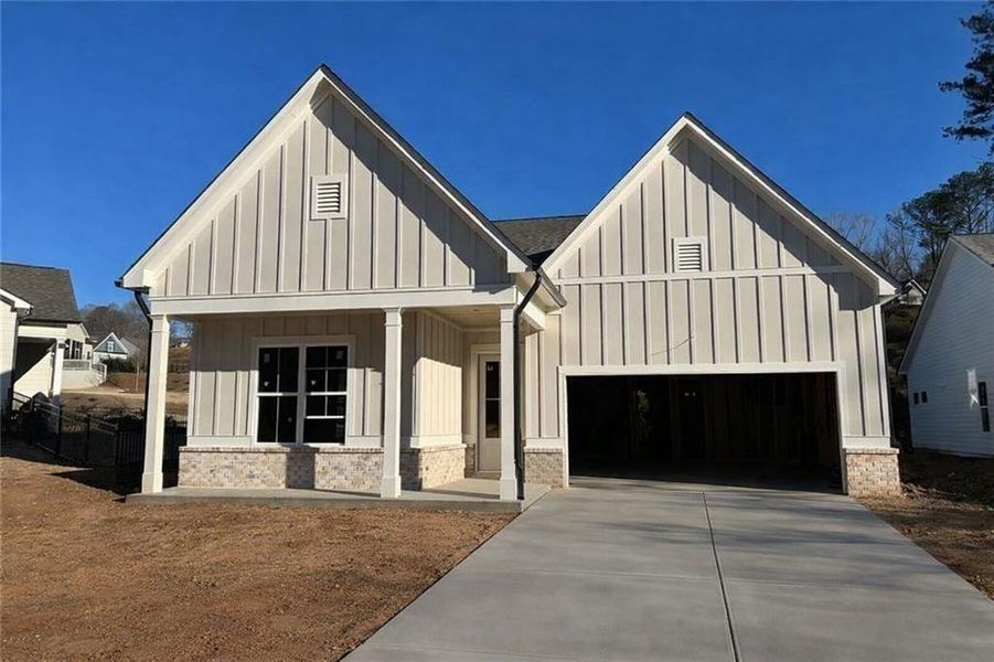 Front exterior of a new home in , Woodstock, GA, highlighting curb appeal (Image 2). Front exterior of a new home in , Woodstock, GA, highlighting curb appeal (Image 2).
