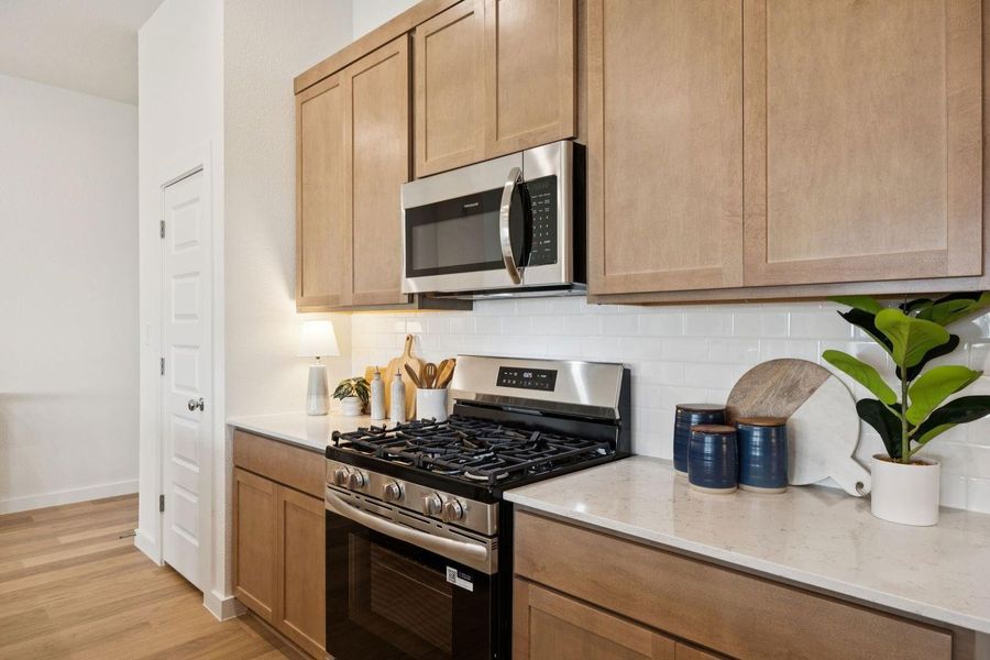 Kitchen in the Diamond home plan by Trophy Signature Homes – REPRESENTATIVE PHOTO