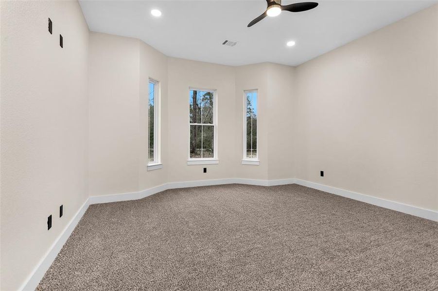 Welcome to bedroom #3 with fabulous window adding architectural design in the room. natural light and a fabulous view of the front yard.