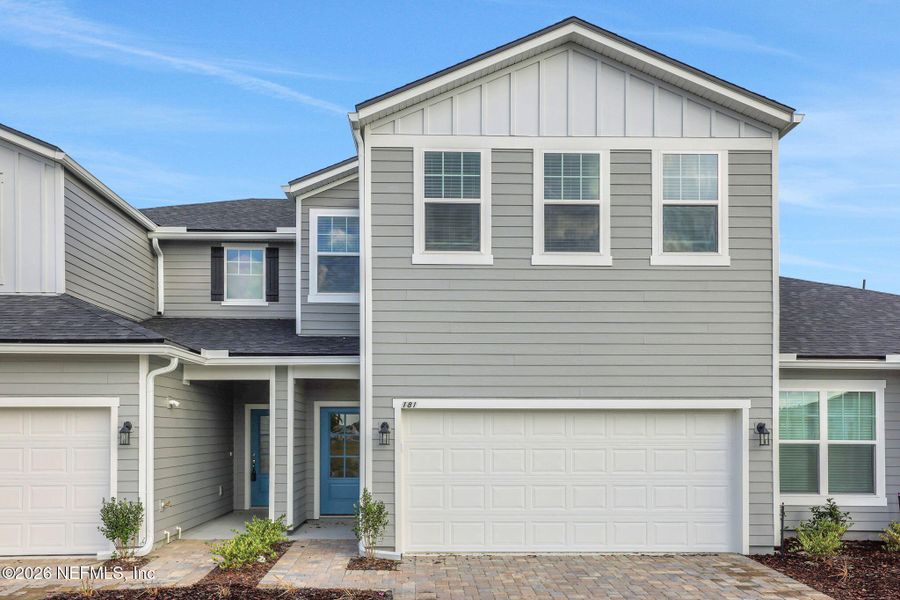 Front exterior of a new home in Cherry Elm at SilverLeaf, St. Augustine, FL, highlighting curb appeal (Image 25).