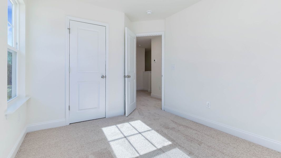 Furnished interior view inside a new home in Battle Bridge, Raleigh (Image 36).