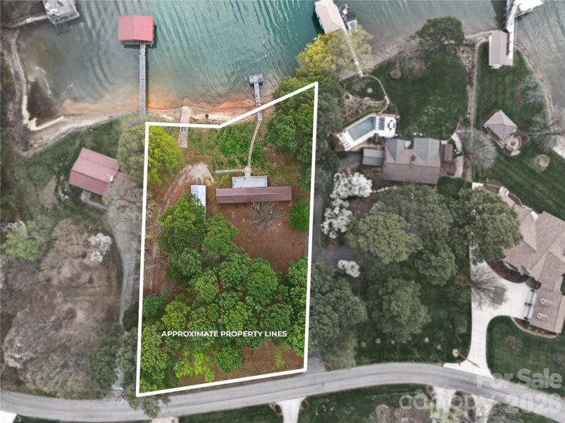 Aerial view highlightingapproximately 0.84 acres with clearly defined property lines,161 feet of shoreline, concreteboat ramp and deeded pier.