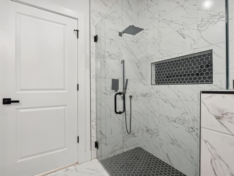 Bathroom with a shower with shower door