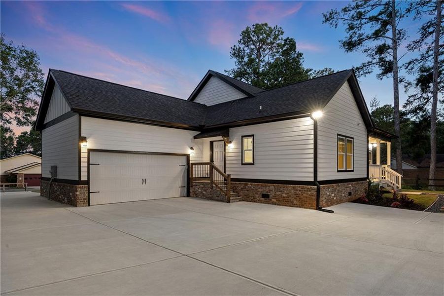 Front exterior of a new home in , Monroe, GA, highlighting curb appeal (Image 28). Front exterior of a new home in , Monroe, GA, highlighting curb appeal (Image 28).