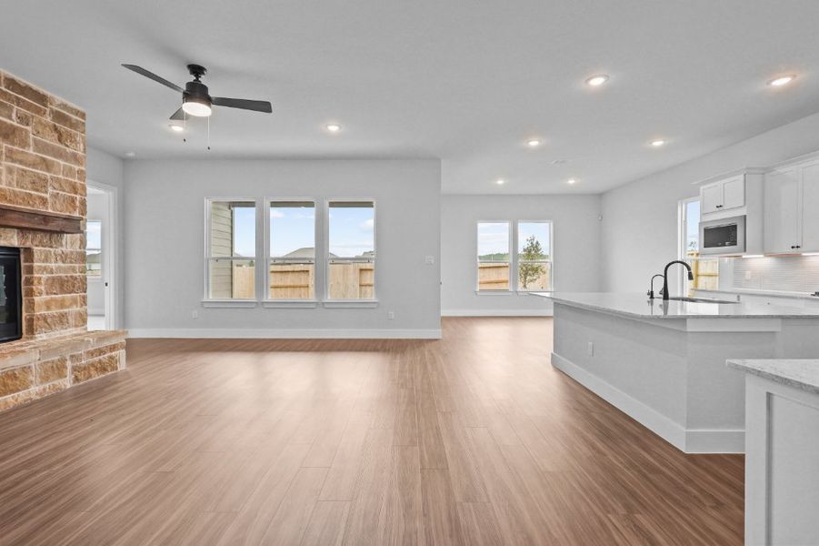 A kitchen with a wood floor. A kitchen with a wood floor.