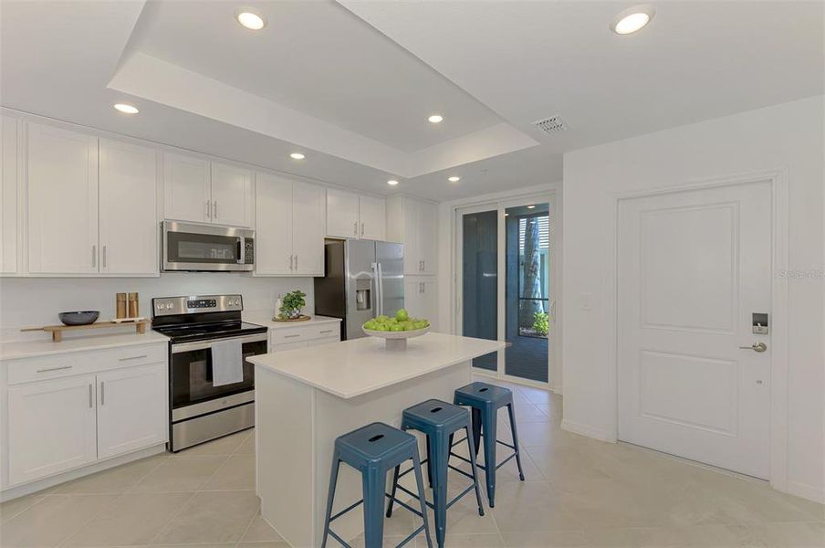 Furnished interior view inside a new home in Wellen Park Golf & Country Club, Venice (Image 17).
