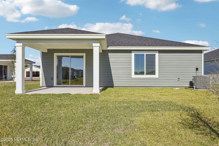 Exterior details and patio area of a home in Cypress Meadows - Signature Series, Jacksonville (Image 4).