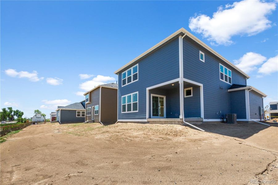 Front exterior of a new home in Granary, Johnstown, CO, highlighting curb appeal (Image 1). Front exterior of a new home in Granary, Johnstown, CO, highlighting curb appeal (Image 1).