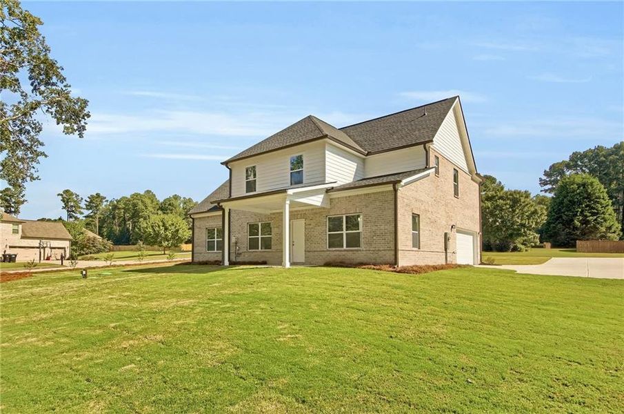 Front exterior of a new home in , McDonough, GA, highlighting curb appeal (Image 18). Front exterior of a new home in , McDonough, GA, highlighting curb appeal (Image 18).
