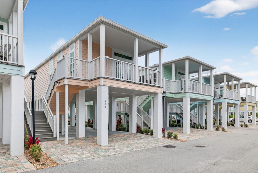 Front exterior of a new home in , Jensen Beach, FL, highlighting curb appeal (Image 1).