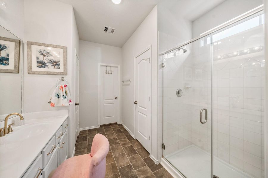 Primary bathroom with private toilet, separate shower and walk in closet
