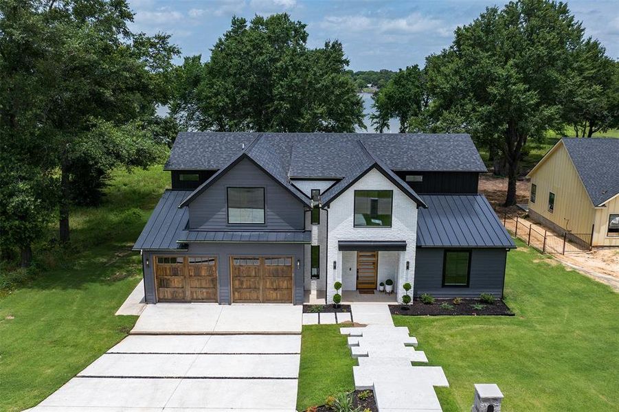 Front exterior of a new home in , Kemp, TX, highlighting curb appeal (Image 2). Front exterior of a new home in , Kemp, TX, highlighting curb appeal (Image 2).