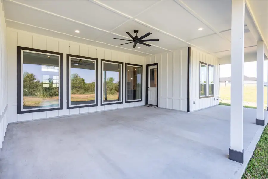 Expansive covered patio perfect for outdoor relaxation and entertainment.