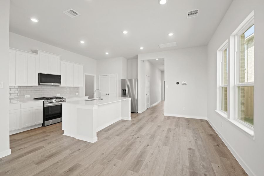 Furnished interior view inside a new home in Creekland Village at Bridgeland, Cypress (Image 8).