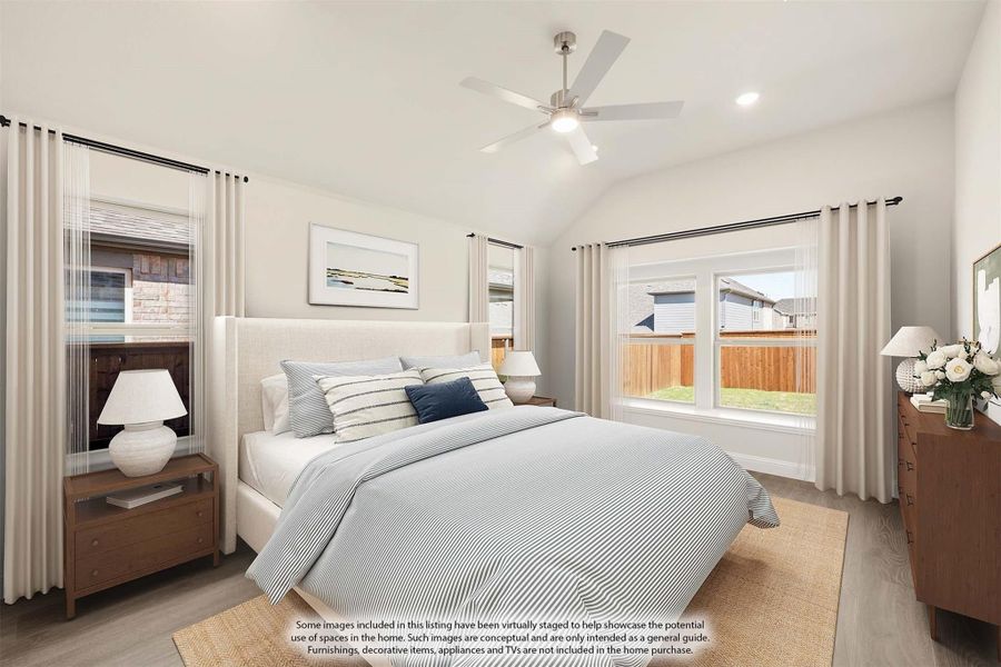 Bedroom with vaulted ceiling, ceiling fan, large windows, and hardwood floors with neutral decor