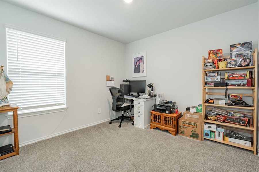 Office space featuring carpet flooring and baseboards