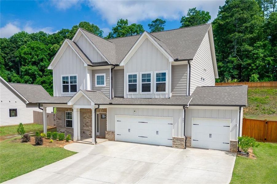 Front exterior of a new home in , Hoschton, GA, highlighting curb appeal (Image 2). Front exterior of a new home in , Hoschton, GA, highlighting curb appeal (Image 2).
