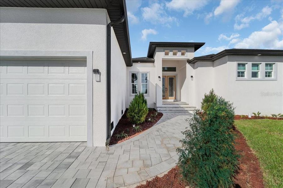 Front exterior of a new home in , Port Charlotte, FL, highlighting curb appeal (Image 26).