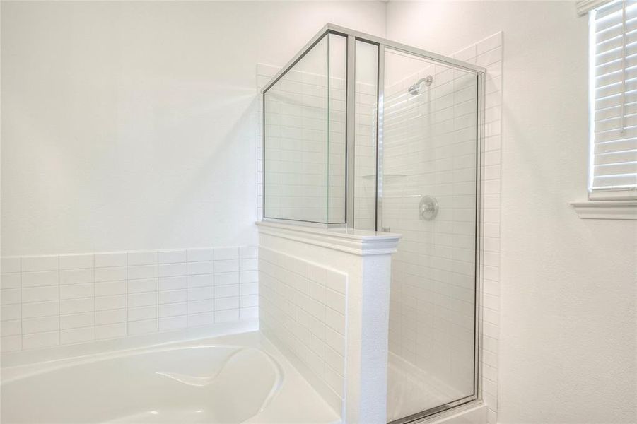 Full bath with a garden tub and a stall shower Full bath with a garden tub and a stall shower