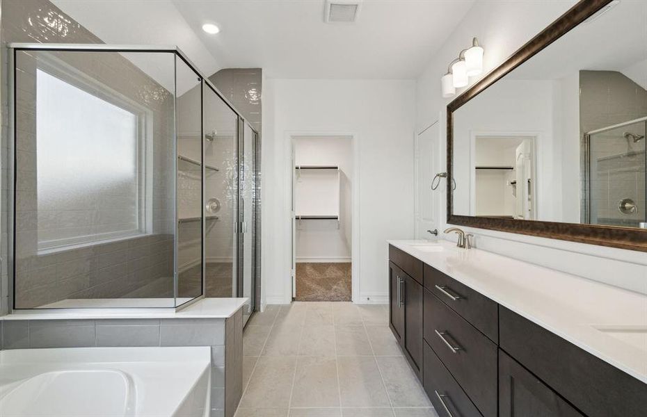 Dual vanity and oversized shower *real home pictured