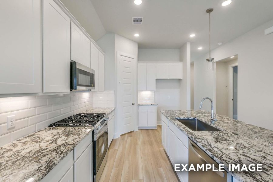 Furnished interior view inside a new home in Sunterra, Katy (Image 6).