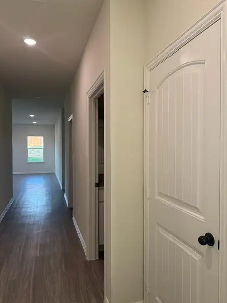 Corridor featuring dark wood finished floors and recessed lighting Corridor featuring dark wood finished floors and recessed lighting