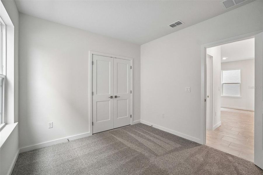 Spacious, unfurnished interior of a new home in Grasslands West, Lakeland (Image 30).