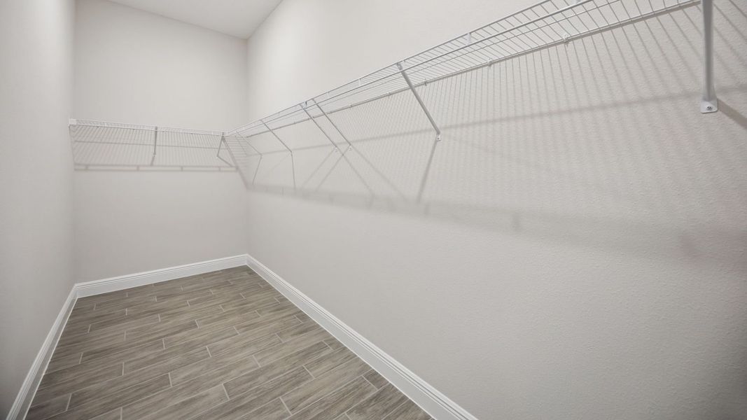Representative unfurnished interior of a home built from the Everett by D.R. Horton in Buena Lago, St. Cloud (Image 29).
