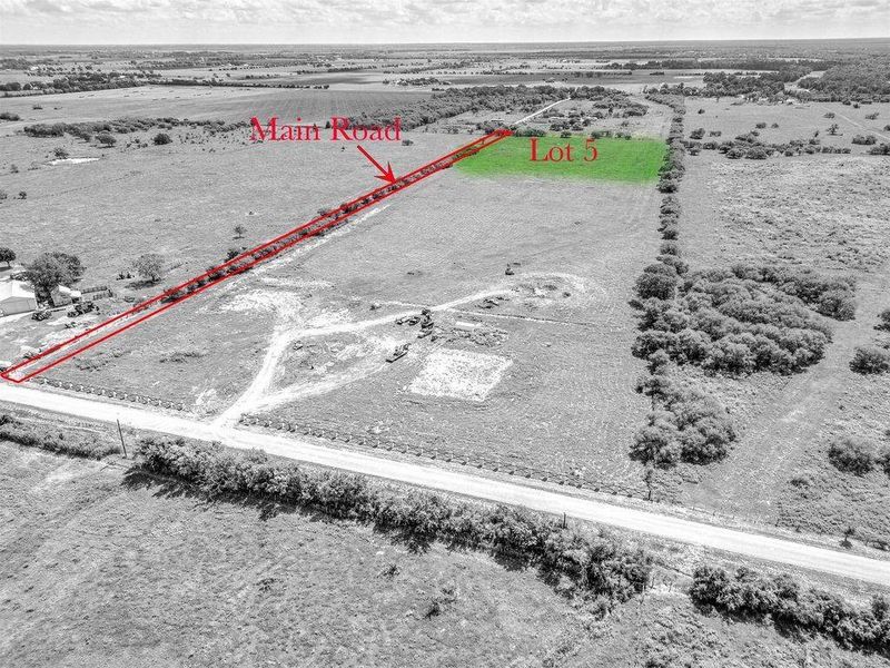 Aerial view illustrating the designated access road leading to the approximately 5-acre homesite and its placement within the surrounding rural acreage.
