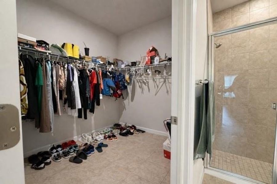 Primary walk in closet Primary walk in closet