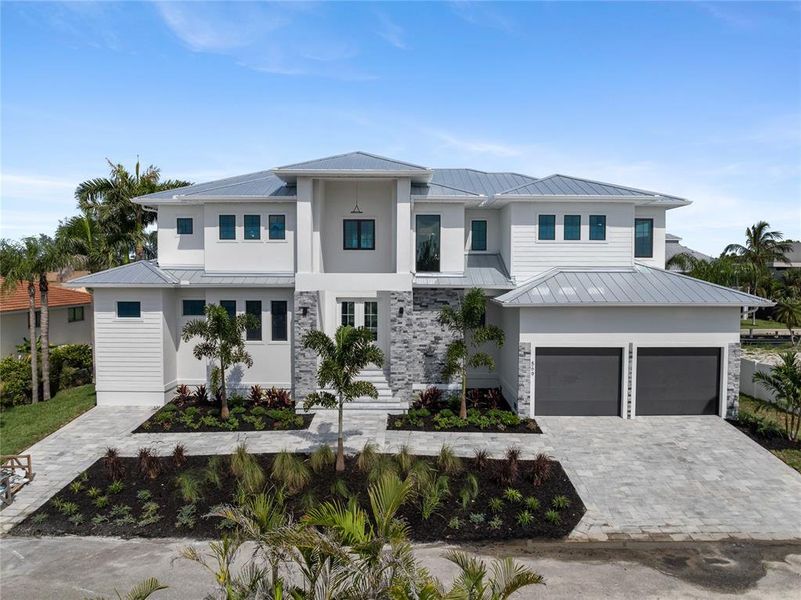 Front exterior of a new home in , Longboat Key, FL, highlighting curb appeal (Image 36). Front exterior of a new home in , Longboat Key, FL, highlighting curb appeal (Image 36).