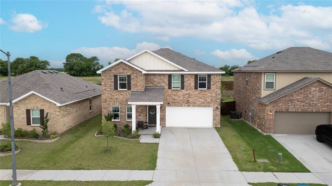 Front exterior of a new home in Ranch at Duck Creek, Fort Worth, TX, highlighting curb appeal (Image 25).