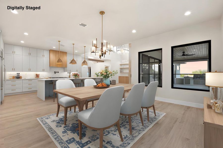 An open-concept living area with abundant recessed lighting flows into a well-appointed kitchen, offering seamless entertaining.