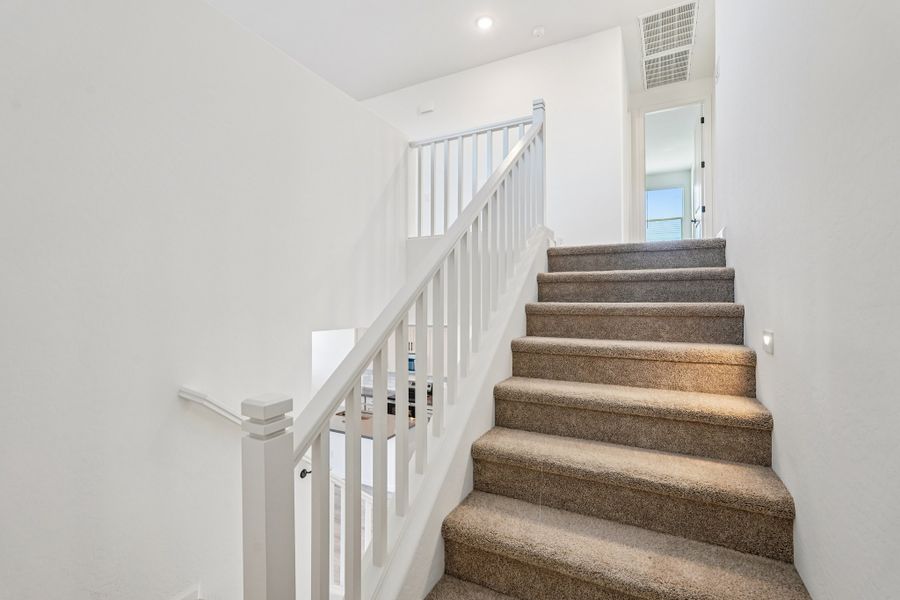 Stairs to second floor. Finishes and options may vary.