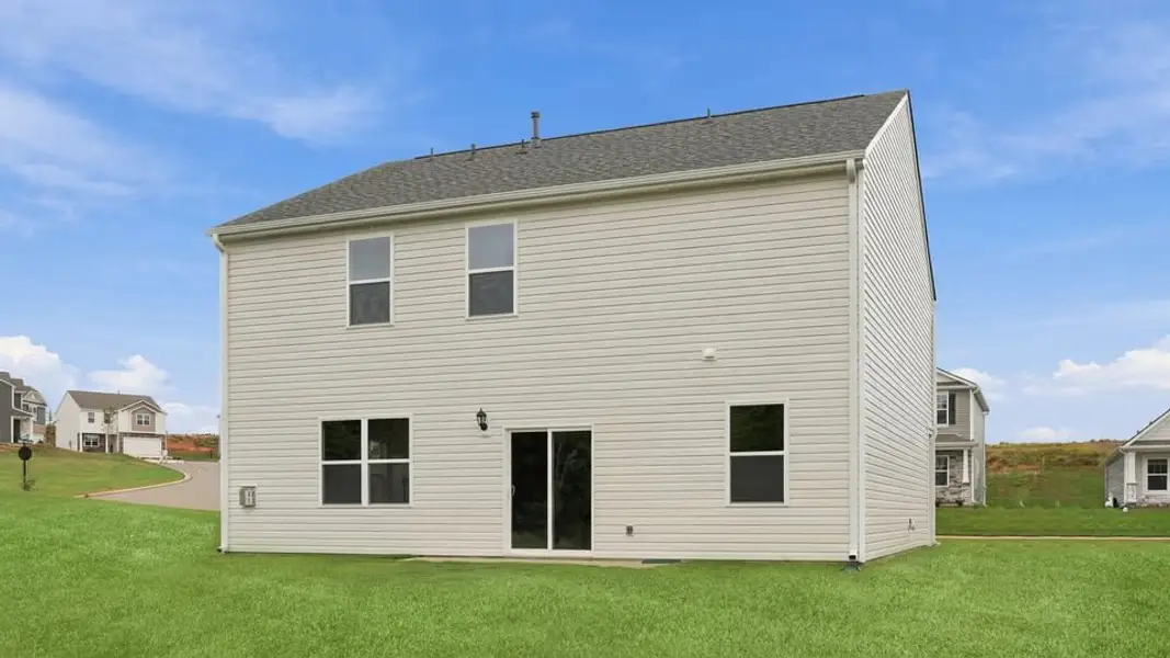 Exterior details and patio area of a home in Durbin Meadows Traditions, Fountain Inn (Image 4).