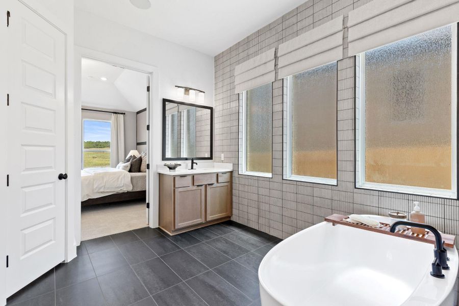 Primary Bath retreat with dual vanities & soaking tub - Representative Photo