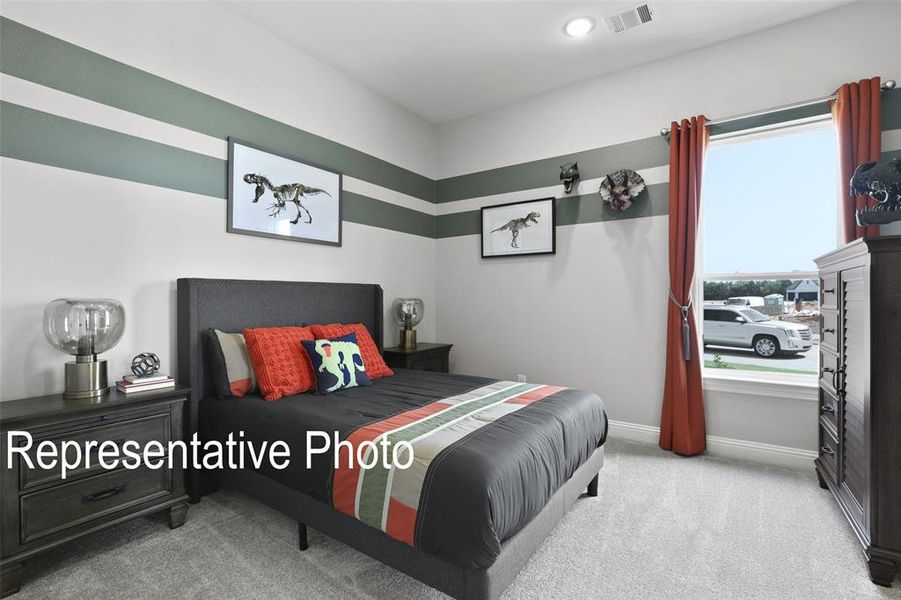 Carpeted bedroom with a large window, recessed lighting, and wall-mounted air vent Carpeted bedroom with a large window, recessed lighting, and wall-mounted air vent