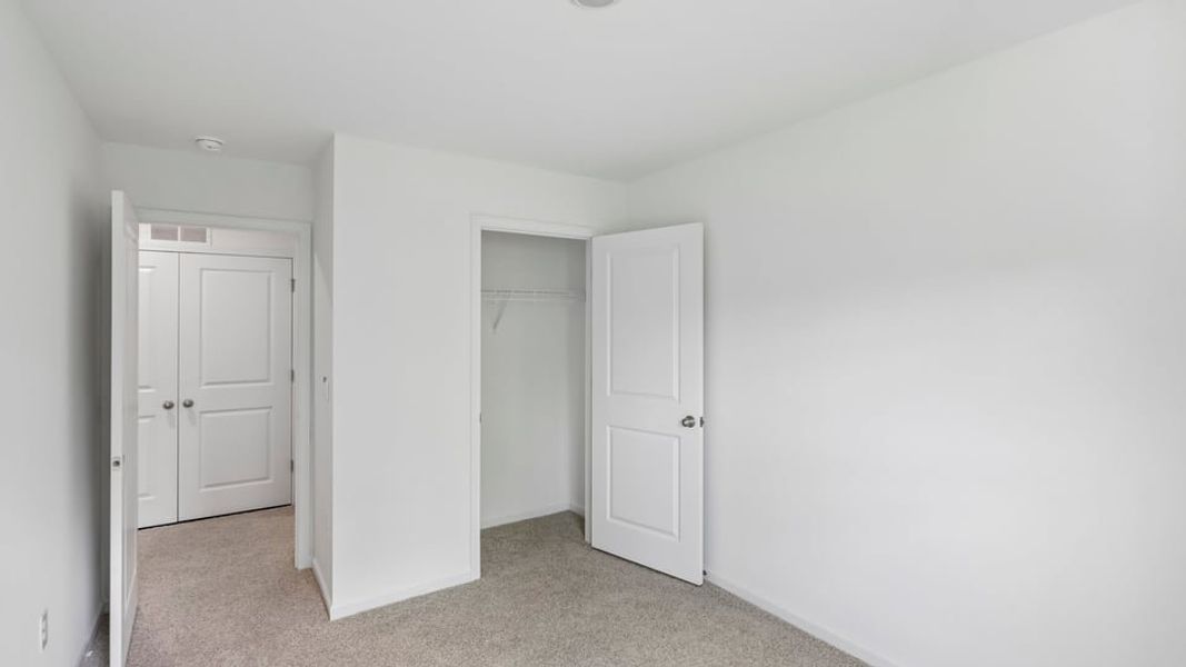 Spacious, unfurnished interior of a new home in The Townes at Belle Grove, Wendell (Image 16).