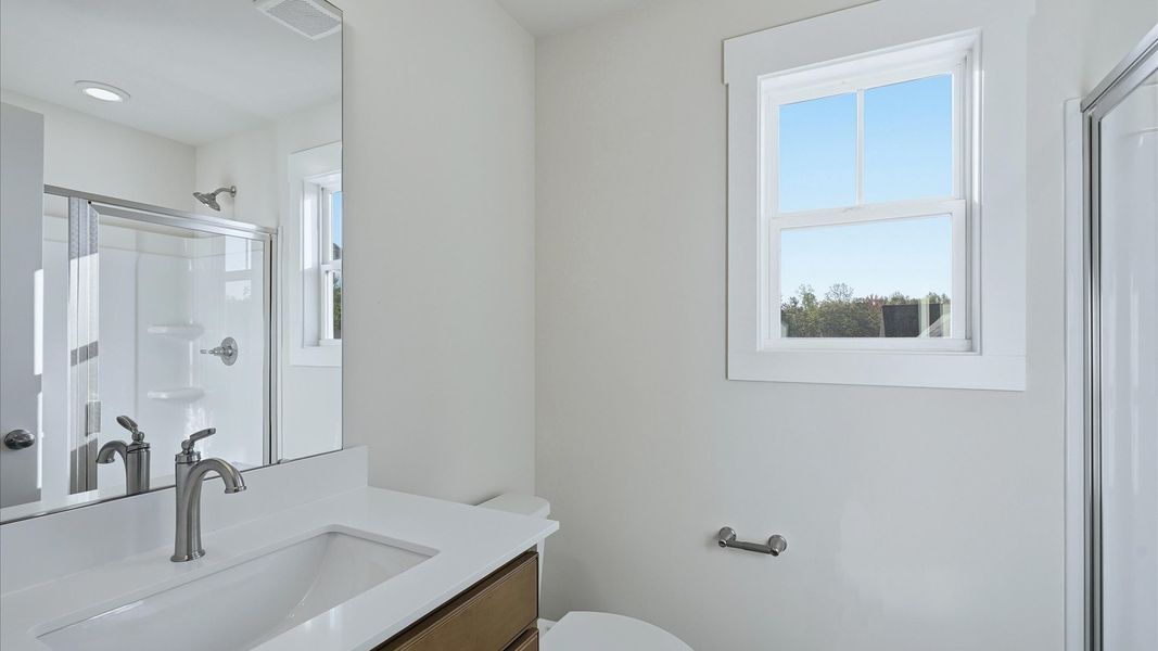 Top-notch bathroom with current fixtures, tasteful materials, and elevated charm near Downtown Simpsonville