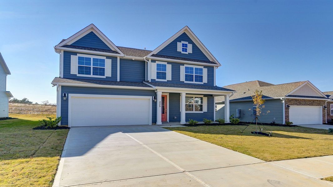 Front exterior of a new home in Livingston Woods, Irmo, SC, highlighting curb appeal (Image 28). Front exterior of a new home in Livingston Woods, Irmo, SC, highlighting curb appeal (Image 28).