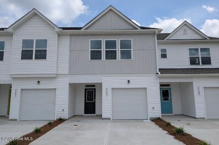 Front exterior of a new home in Coastal Haven, Leland, NC, highlighting curb appeal (Image 1). Front exterior of a new home in Coastal Haven, Leland, NC, highlighting curb appeal (Image 1).