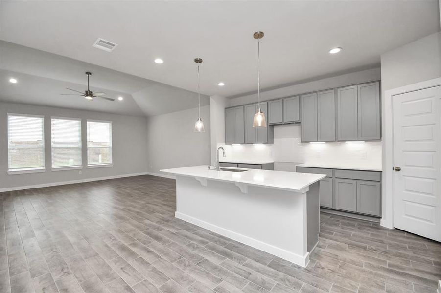 This generously spacious kitchen is a dream realized! Sample photo of completed home with similar floor plan. Actual colors and selections may vary.