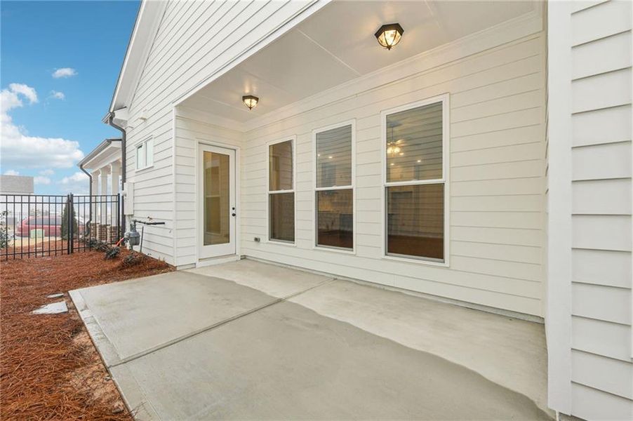 Exterior details and patio area of a home in Promenade at Sawnee Village, Cumming (Image 22).