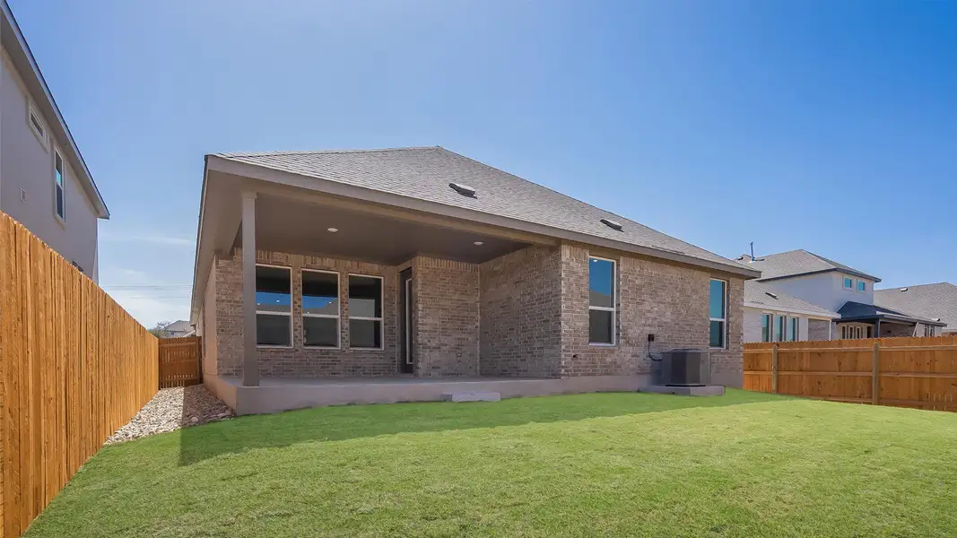 Front exterior of a new home in Rosenbusch Ranch, Leander, TX, highlighting curb appeal (Image 1). Front exterior of a new home in Rosenbusch Ranch, Leander, TX, highlighting curb appeal (Image 1).