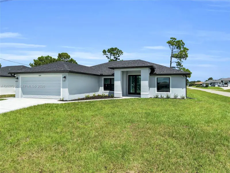 Front exterior of a new home in , Lehigh Acres, FL, highlighting curb appeal (Image 1). Front exterior of a new home in , Lehigh Acres, FL, highlighting curb appeal (Image 1).