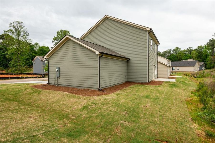 Front exterior of a new home in , Lawrenceville, GA, highlighting curb appeal (Image 1).