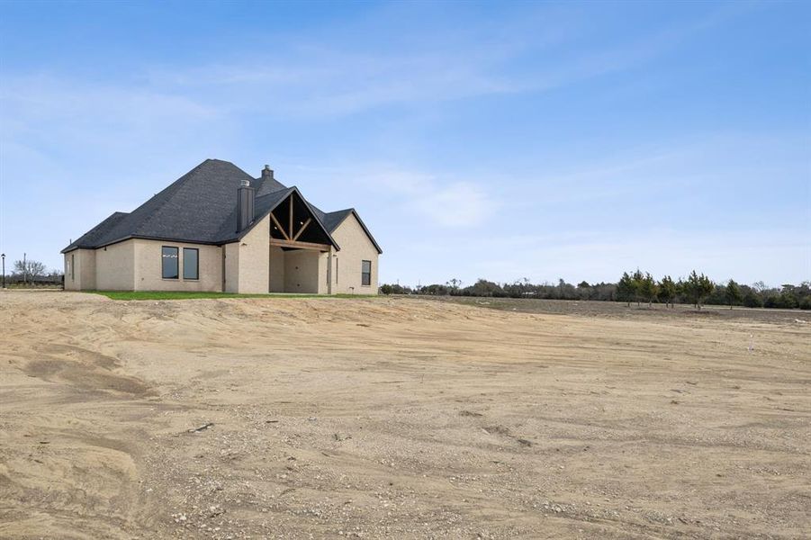 Front exterior of a new home in , Midlothian, TX, highlighting curb appeal (Image 16). Front exterior of a new home in , Midlothian, TX, highlighting curb appeal (Image 16).